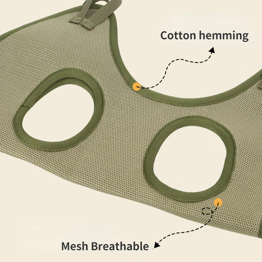 Close-up of the green grooming hammock showing breathable mesh fabric and cotton-hemmed leg openings