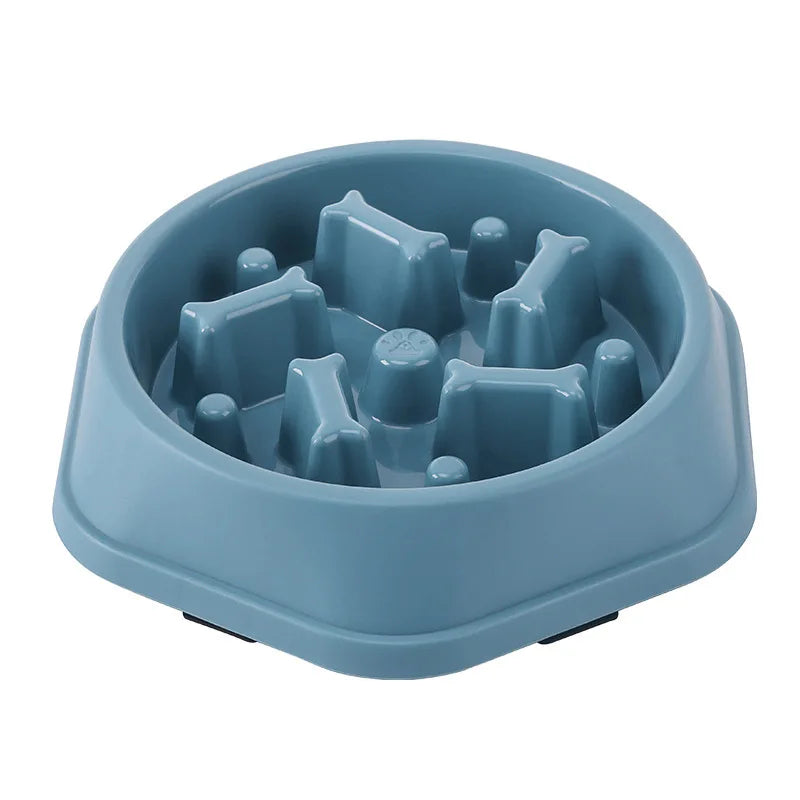 Blue maze slow feeder dog bowl on a white background, angled view of the empty bowl