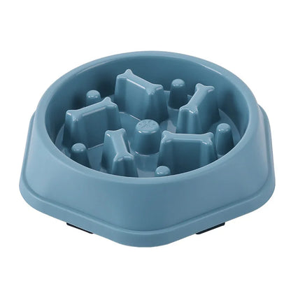 Blue maze slow feeder dog bowl on a white background, angled view of the empty bowl