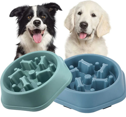 Green and blue slow feeder dog bowls shown with a Border Collie and a Golden Retriever puppy