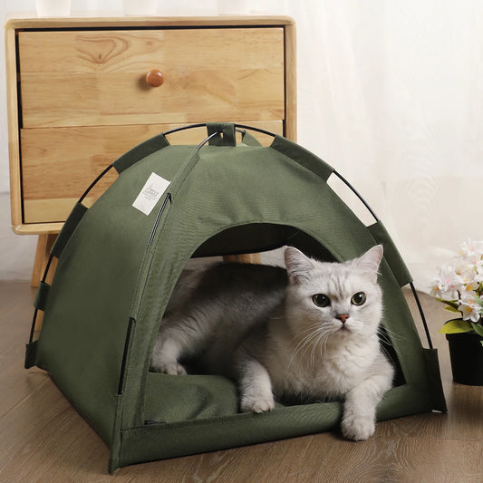 Army green pet tent bed with a white cat resting inside on the cushioned base