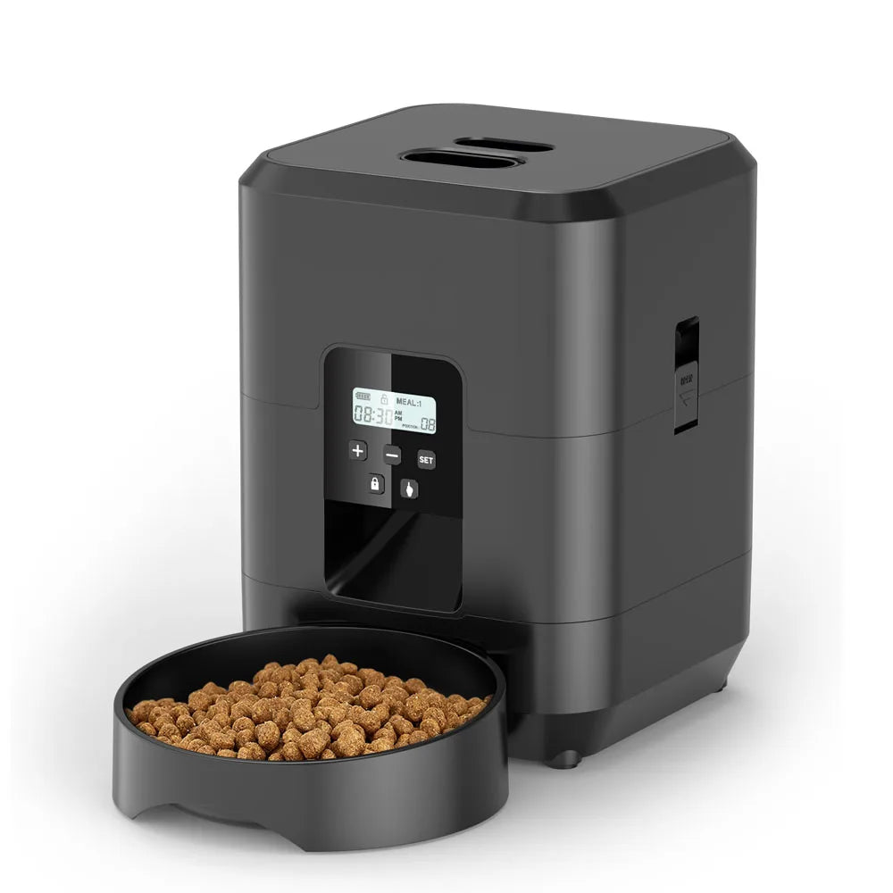 Black automatic pet feeder with LCD button control panel and a bowl of dry cat food