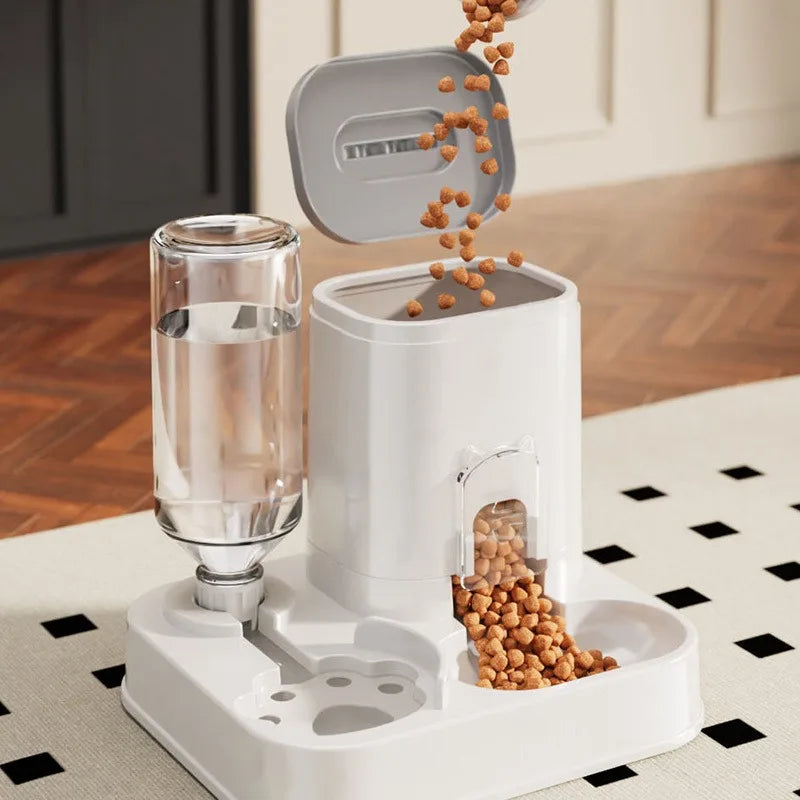 Refilling the automatic pet feeder hopper with dry kibble