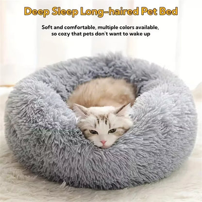 Gray faux-fur donut pet bed with a long-haired cat curled up inside