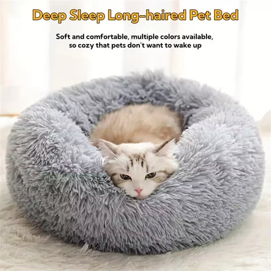 Gray faux-fur donut pet bed with a long-haired cat curled up inside