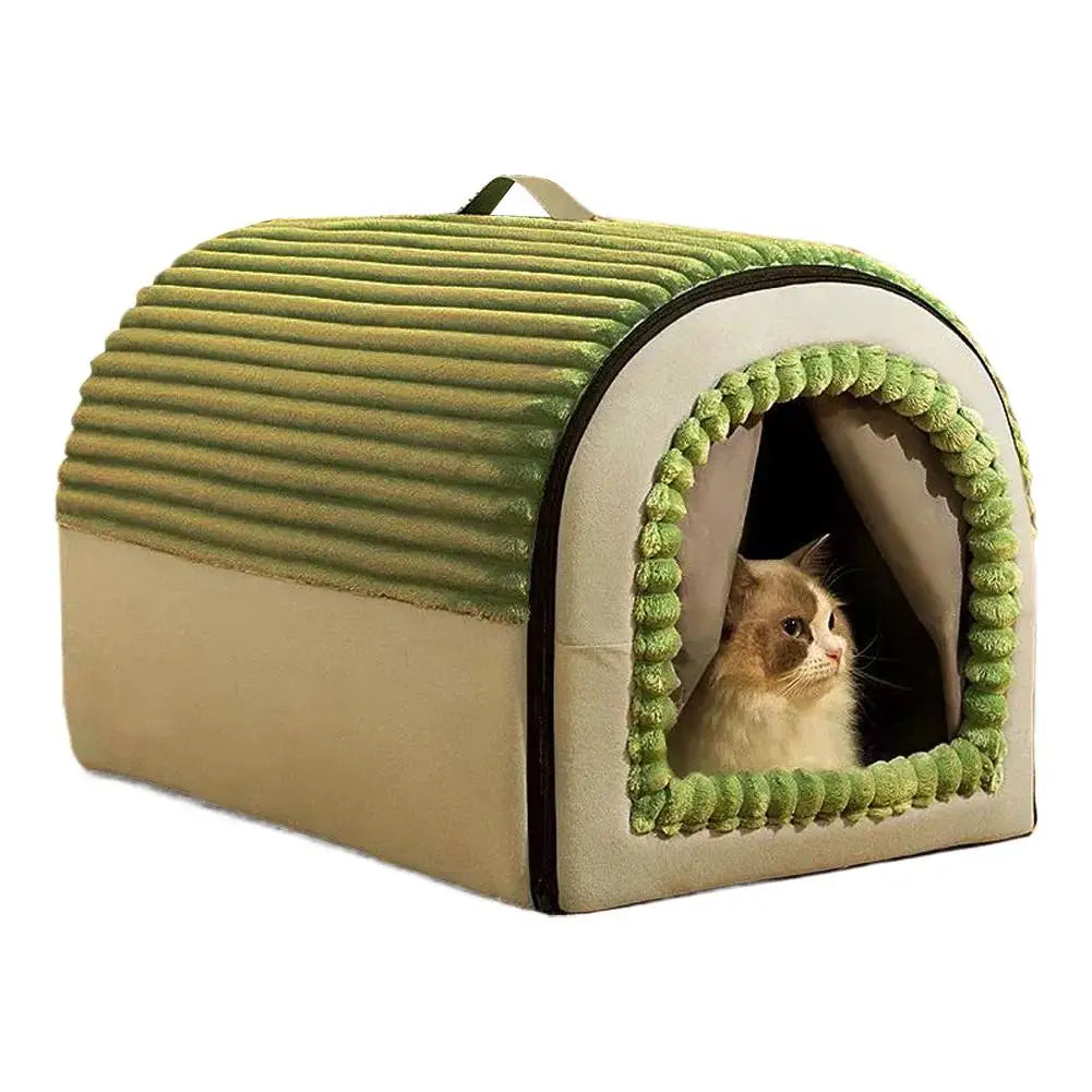 Green and beige corduroy enclosed cat cave bed with a cat looking out of the doorway