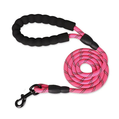 Bright pink reflective rope dog leash with black padded handle and metal swivel clasp