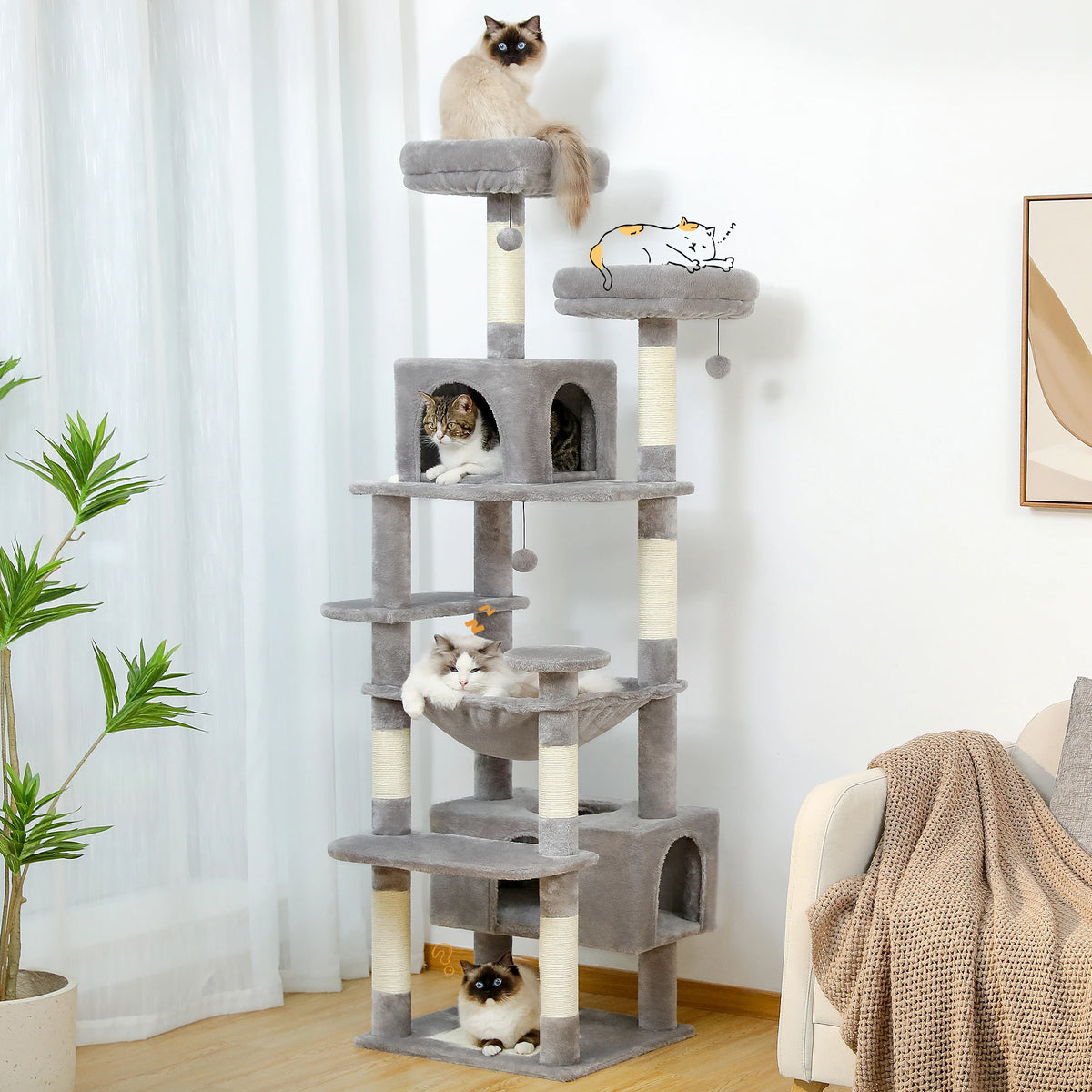 Light gray tall cat tree tower with condos, a hammock and sisal scratching posts in a bright living room with four cats