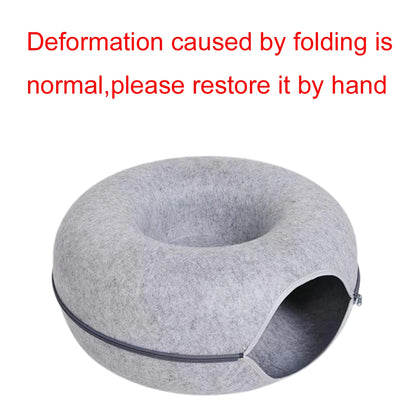 Light grey felt cat donut bed seen from above showing the open centre and side tunnel entrance