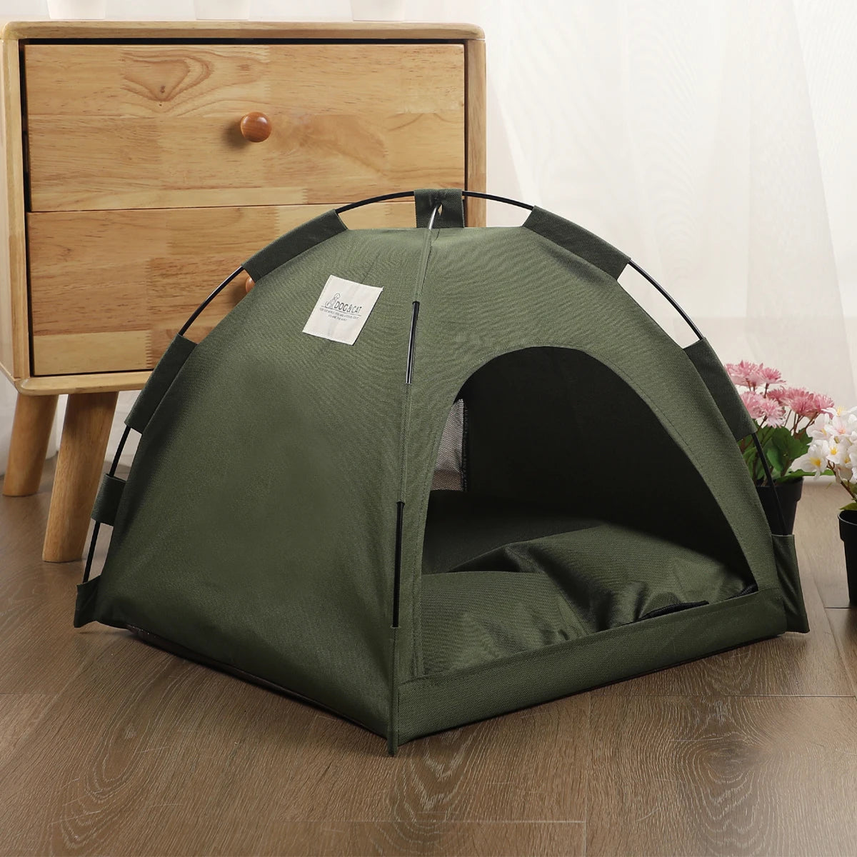 Army green pet tent bed with the zip-open front door and cushion mat inside