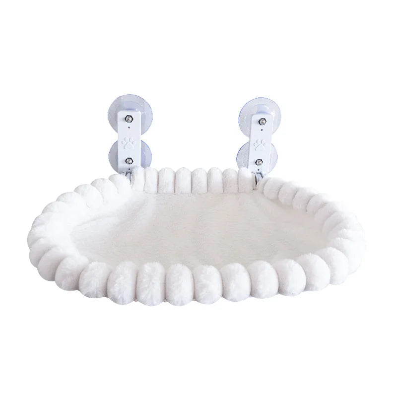 White pom-pom trim oval cat window hammock with two suction cup mounting brackets on a plain white background