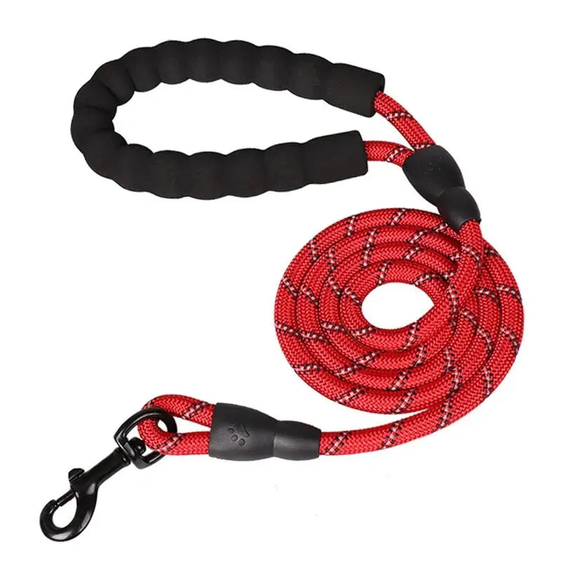 Red reflective rope dog leash coiled with black padded handle and metal swivel clasp