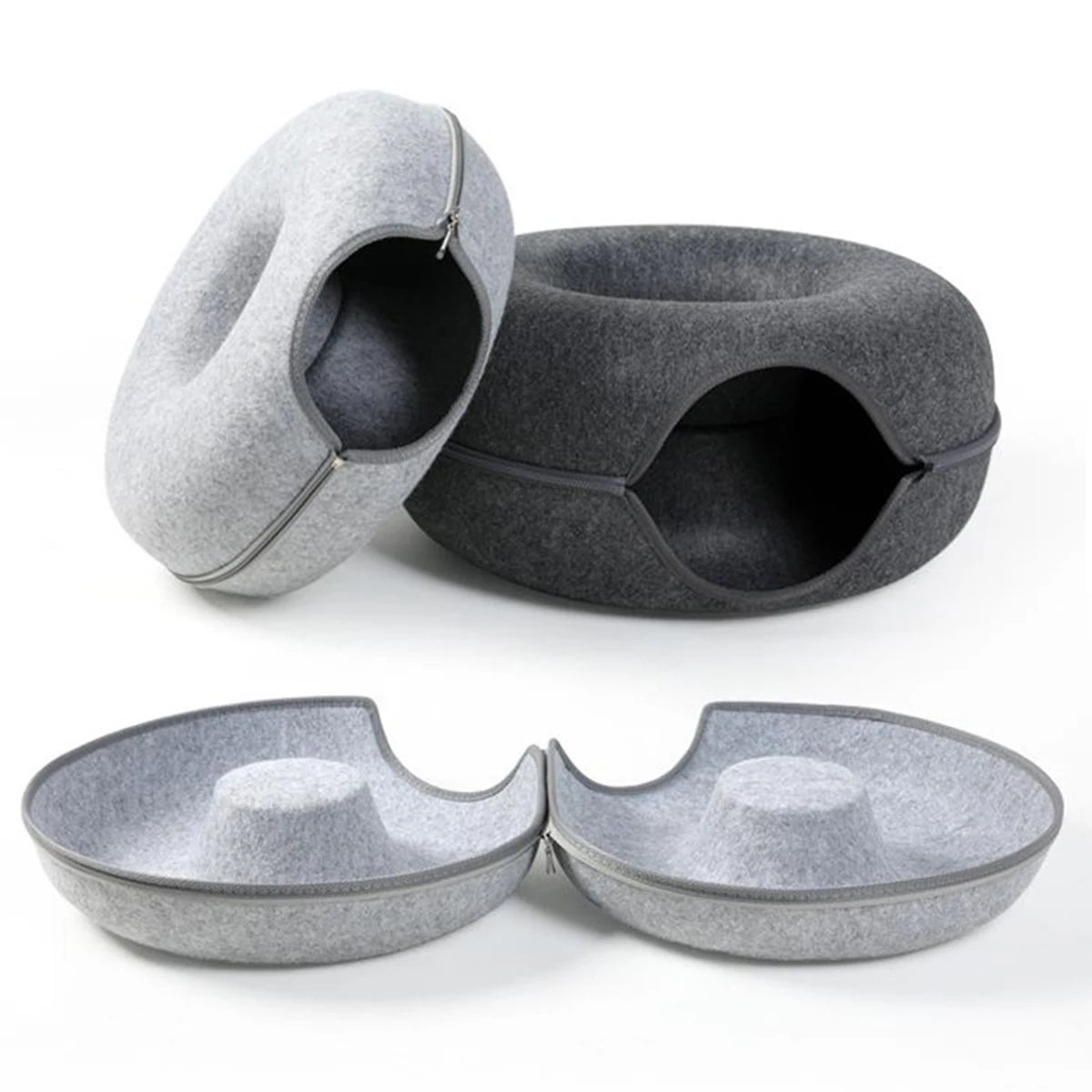 Light and dark grey felt cat donut beds shown zipped closed and unzipped into two flat nests