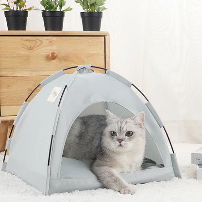 Cyan grey cat tent bed with a grey and white cat lying in the entrance