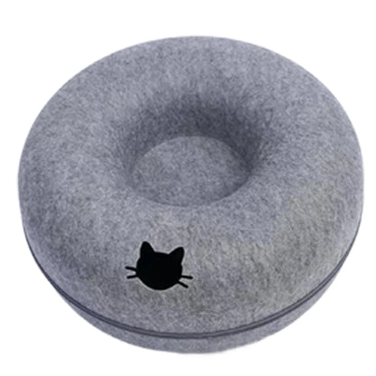 Dark grey cat head style felt donut bed with a cat face shaped entrance on a white background