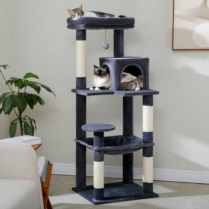 Dark grey cat tree in a living room with two cats in the condo and one on the top perch