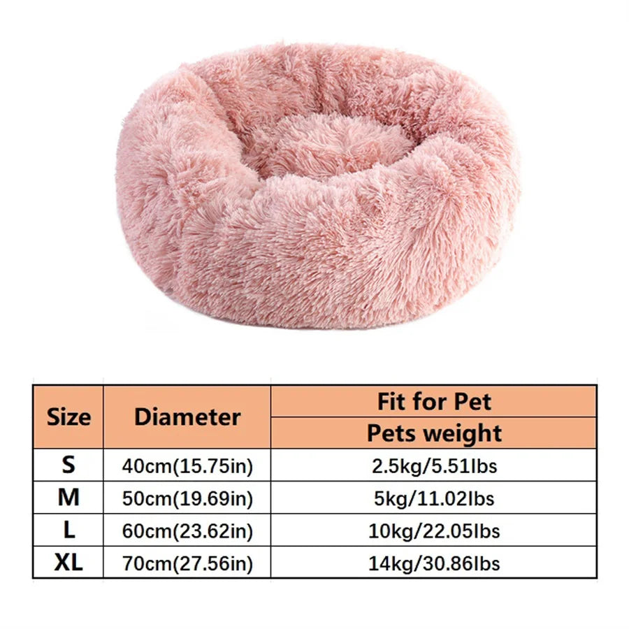 Pink donut pet bed with a size table listing S to XL diameters and pet weight limits