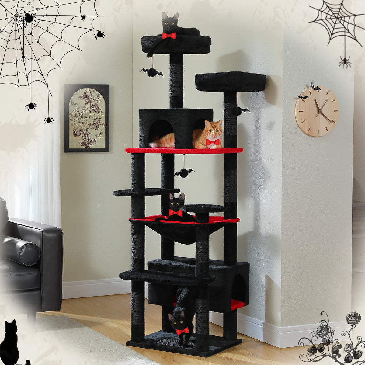 Black cat tree tower with red trimmed platforms and hammock in a Halloween-decorated room with three cats