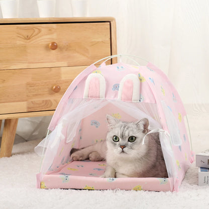 Pink rabbit ear cat tent bed with lace curtains and a cat lying inside