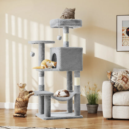 Light grey 43.6-inch cat tree in a sunlit living room with three cats using the top perch, condo and lower platform