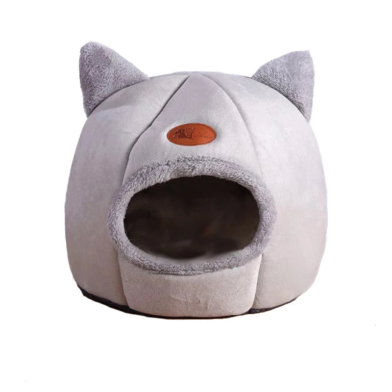 Front view of an empty light grey cat cave bed showing the rounded entrance
