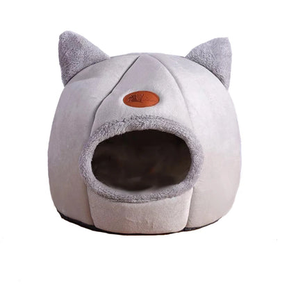 Front view of an empty light grey cat cave bed showing the rounded entrance
