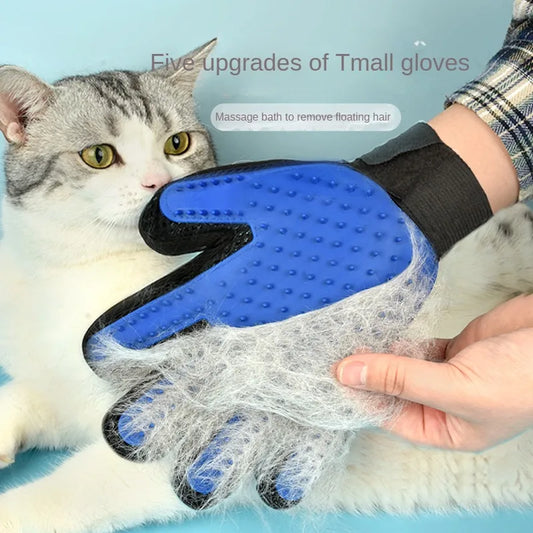 Blue silicone pet grooming glove lifting loose fur from a gray tabby cat