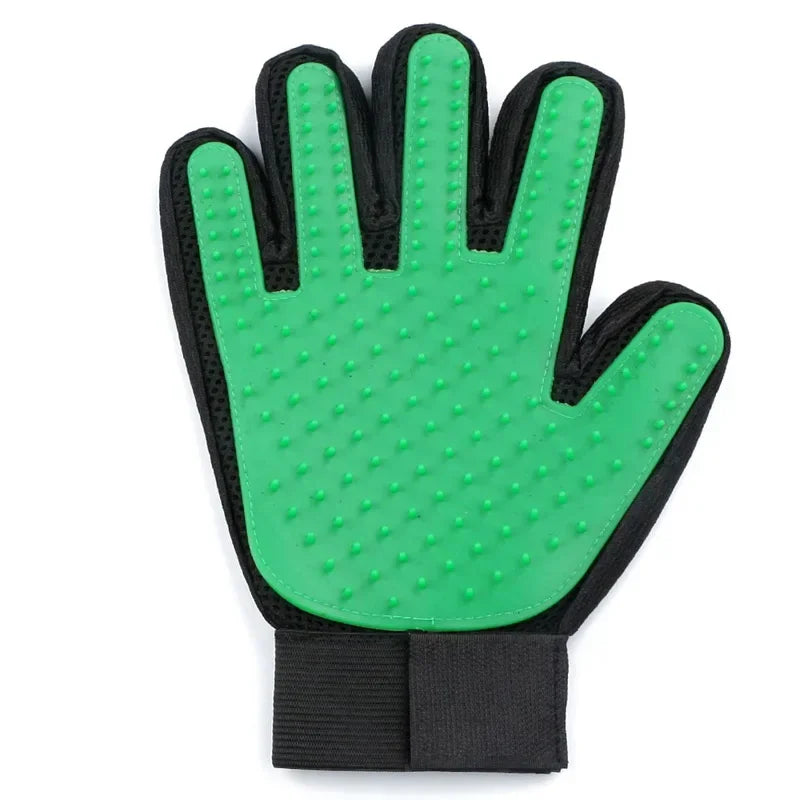 Green silicone pet grooming glove with black trim and adjustable wrist strap on a white background